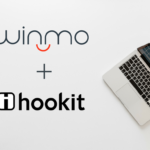 Laptop in a grey background with Winmo and Hookit's logo